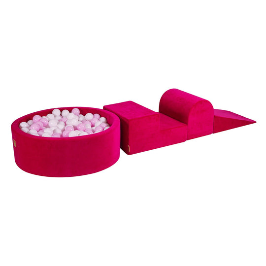Spielset aus samtig-magentafarbenem Schaumstoff mit rundem Bällebad